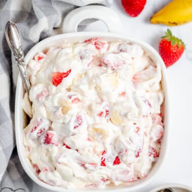 strawberry banana cheesecake salad in a white bowl