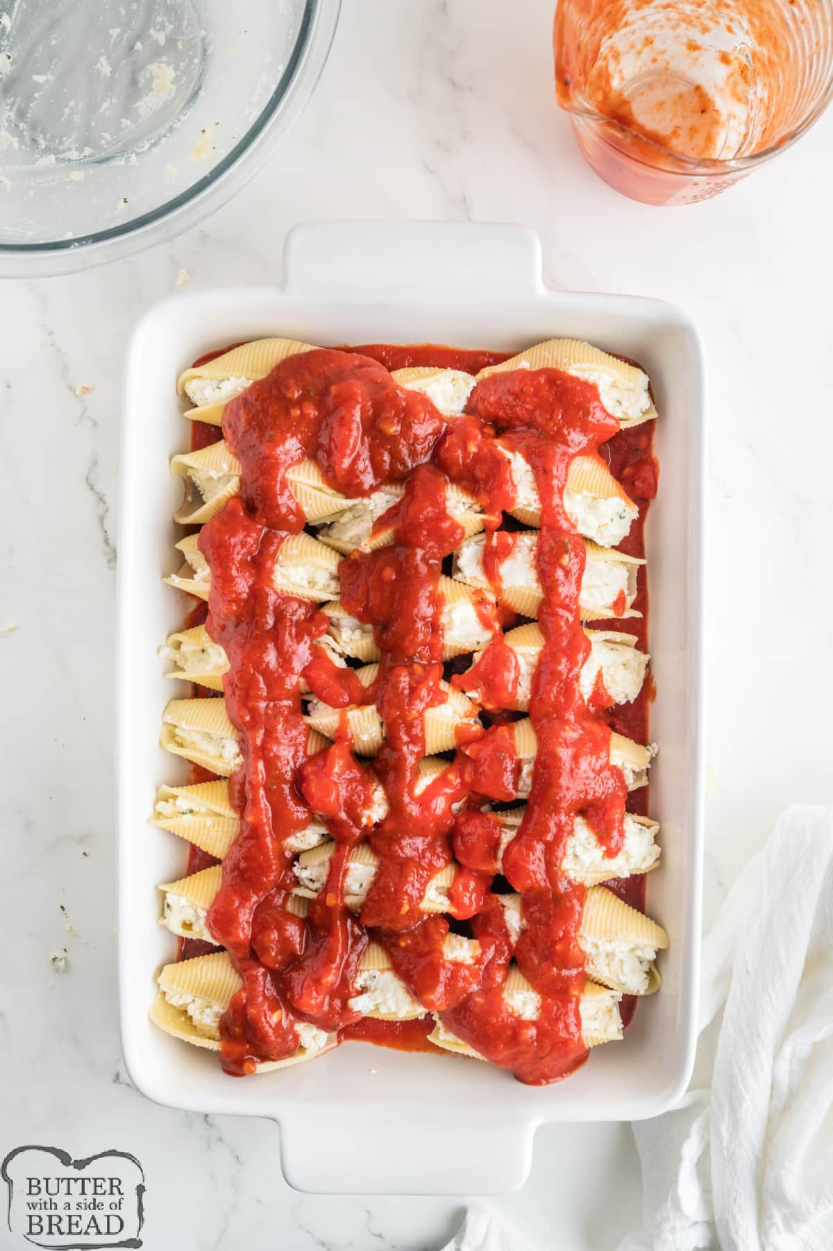 Assembling pasta shell recipe.