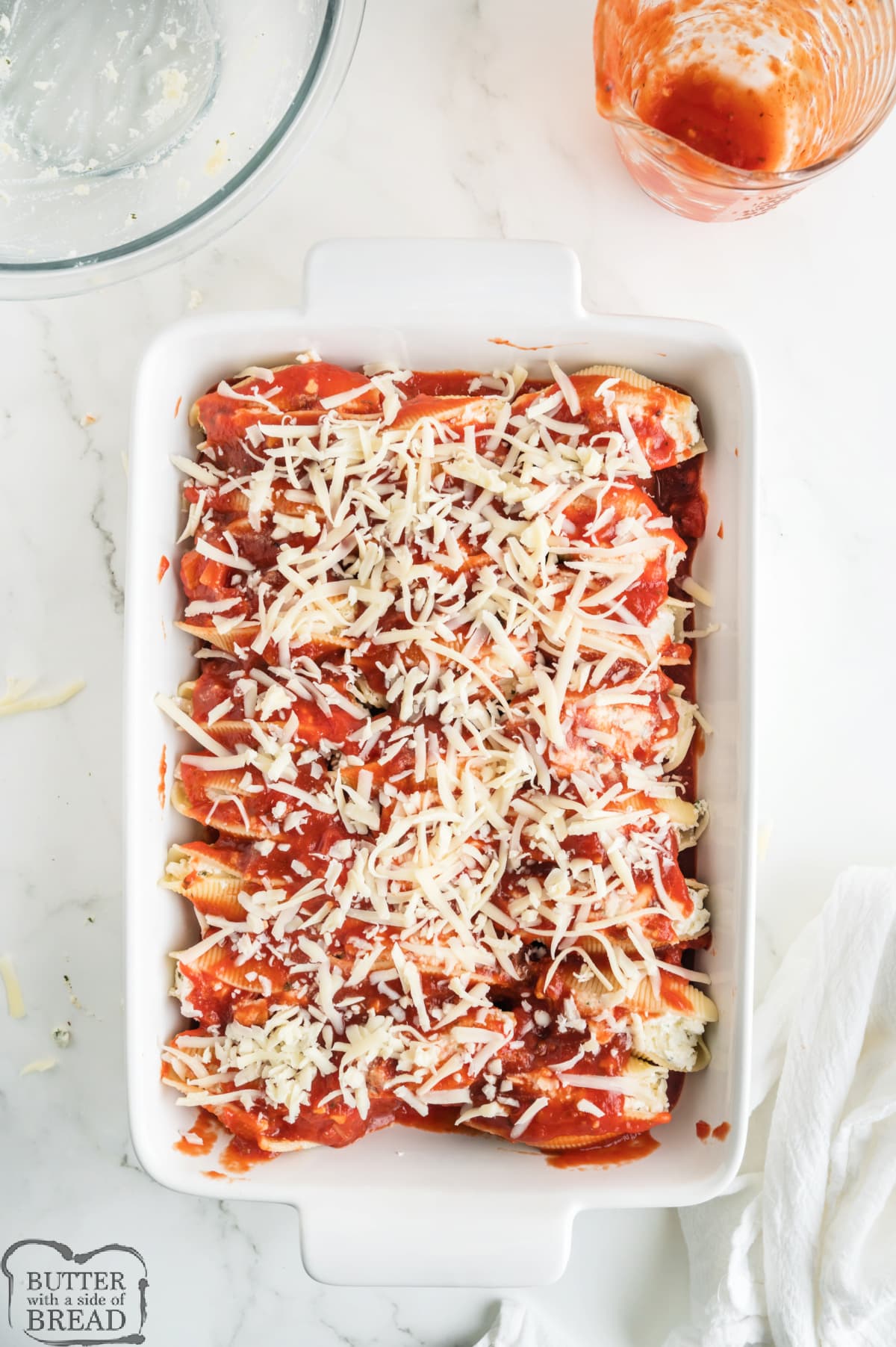 Stuffed shells topped with marinara sauce and shredded mozzarella cheese.