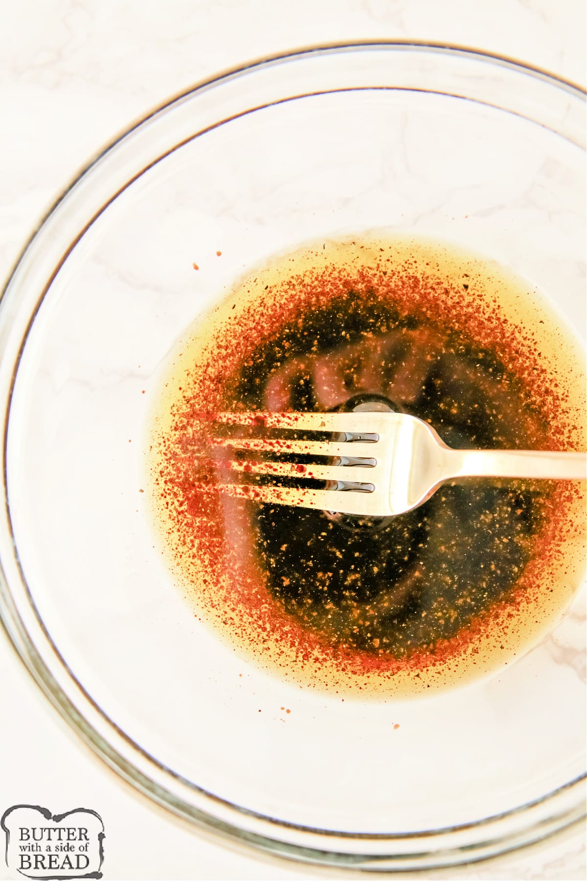 Salad dressing made with olive oil and balsamic vinegar. 