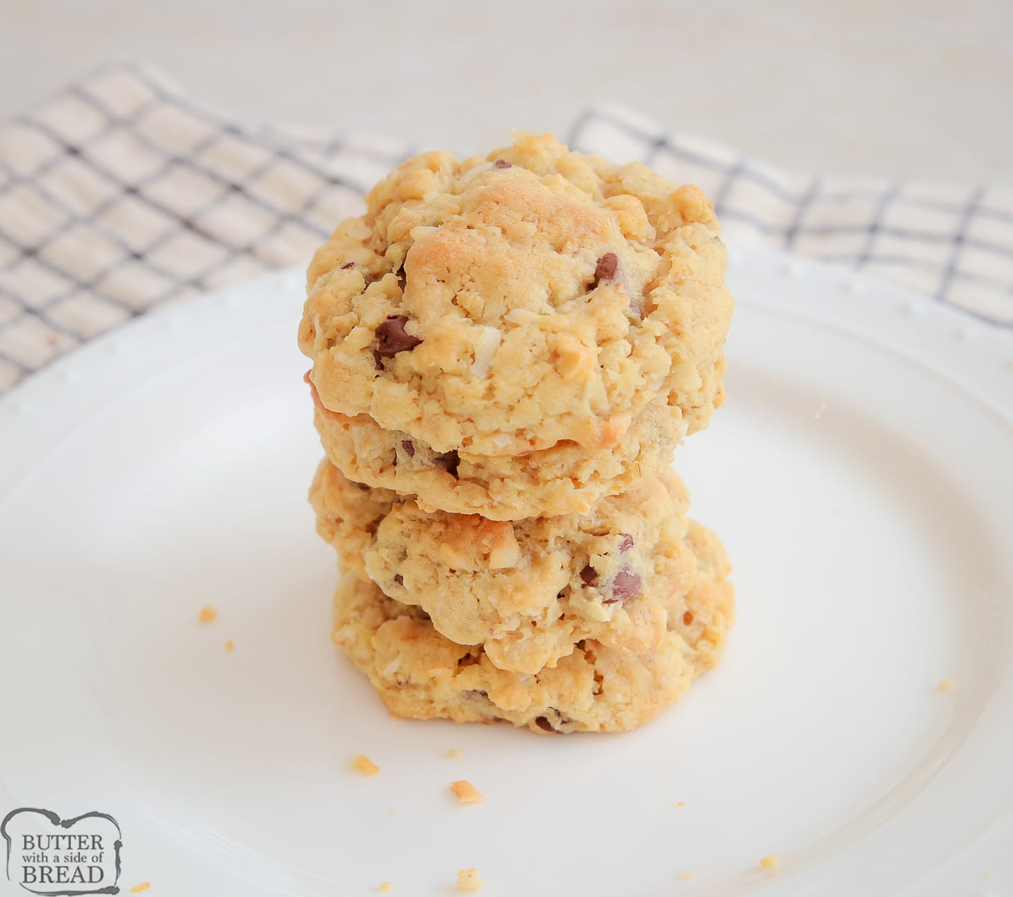 stack of ranger cookies on a white plate