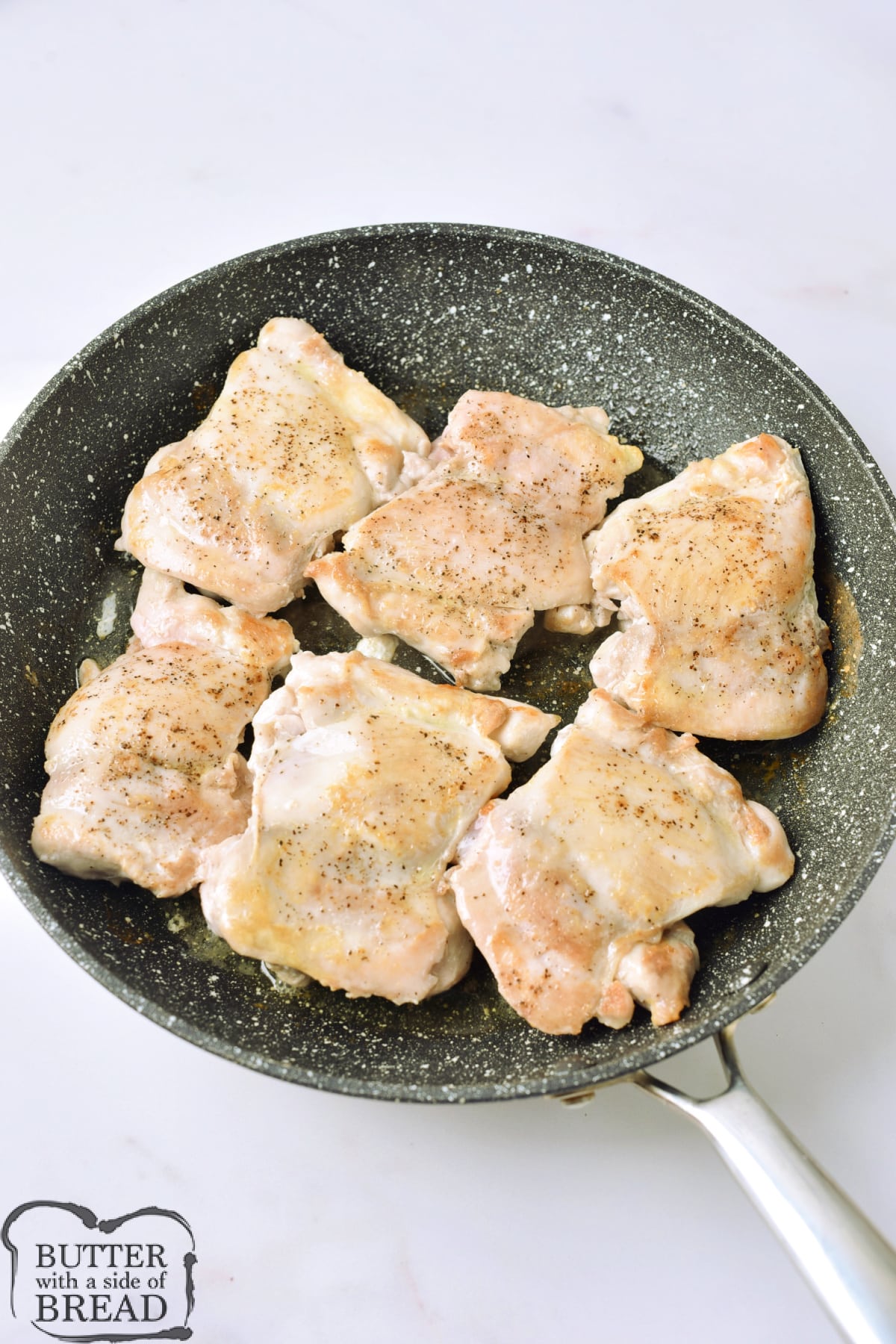 Cook chicken thighs in a skillet with olive oil. 