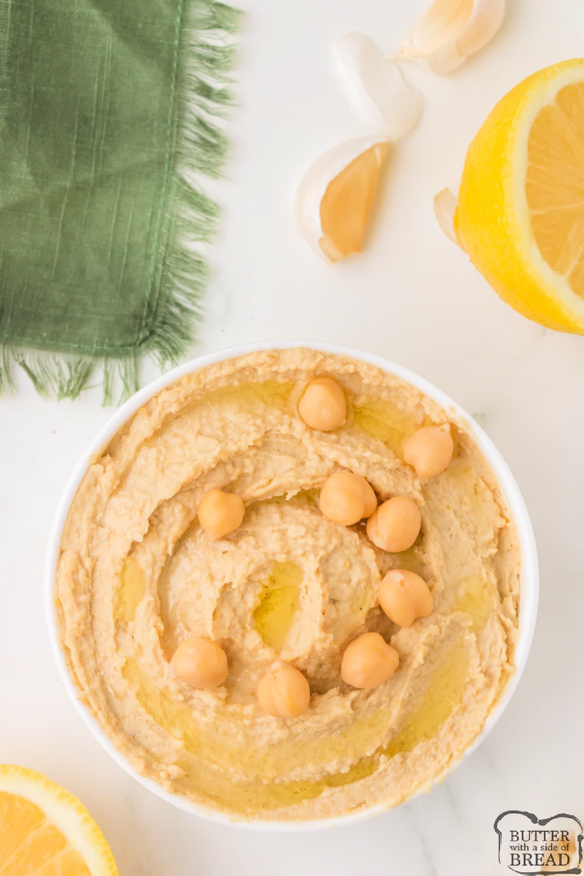 Easy Hummus recipe that can be made in less than 5 minutes. This simple hummus recipe pairs perfectly with raw veggies, pita bread, and crackers.