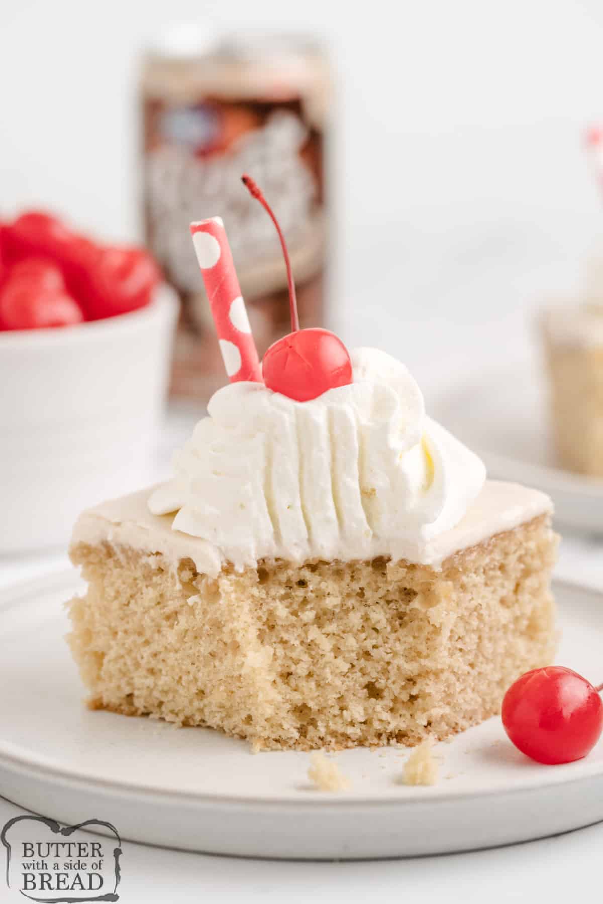 Root beer cake with whipped cream and cherries. 