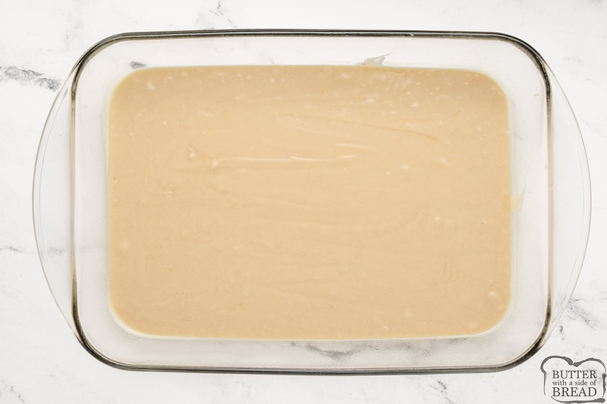 Pouring cake batter into a 9X13 pan.