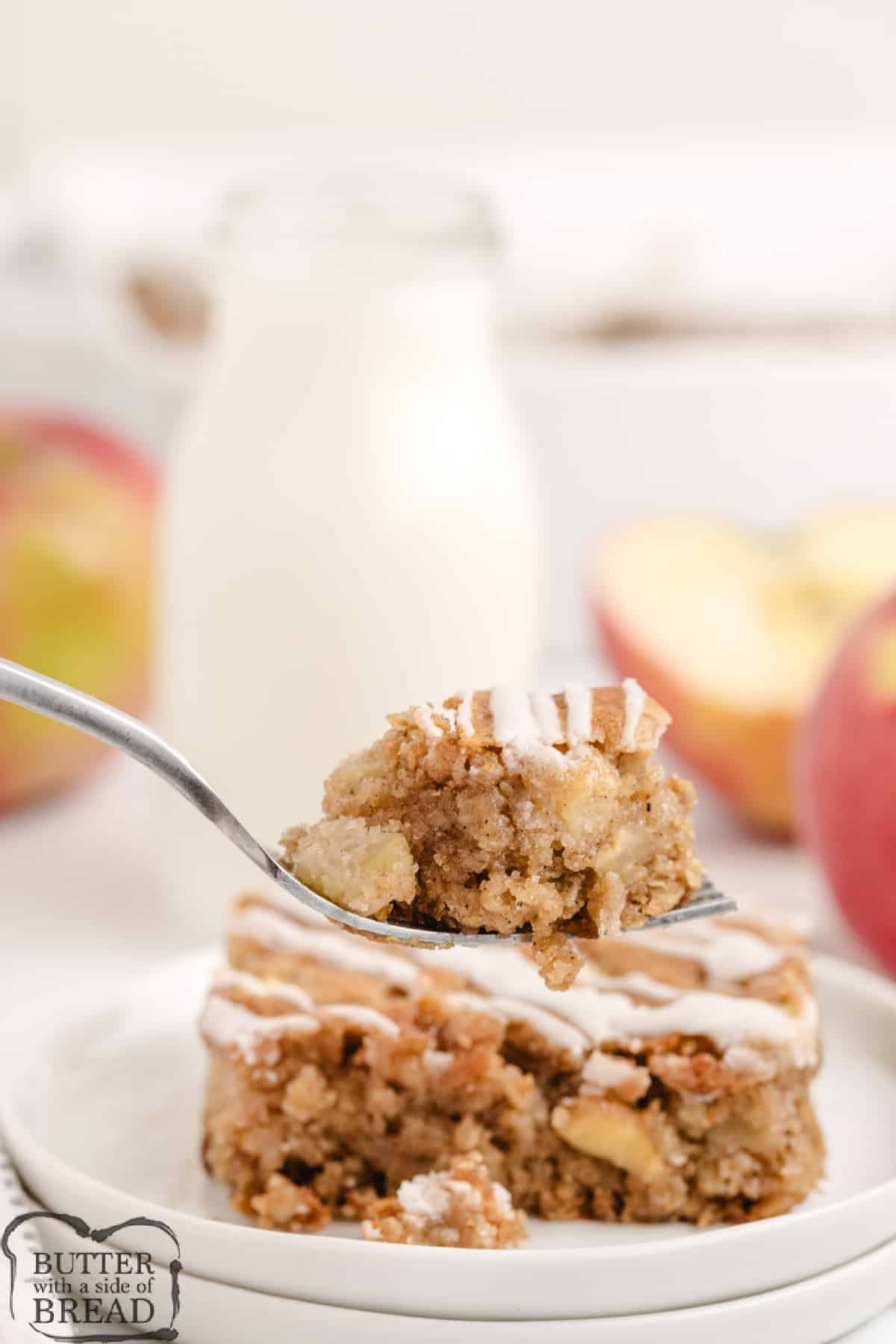 Forkful of spiced apple cinnamon coffee cake made with oats.