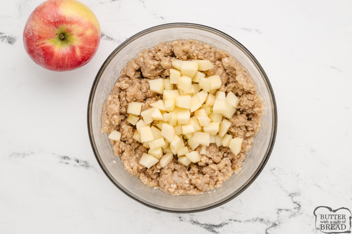 Folding diced apple into batter.