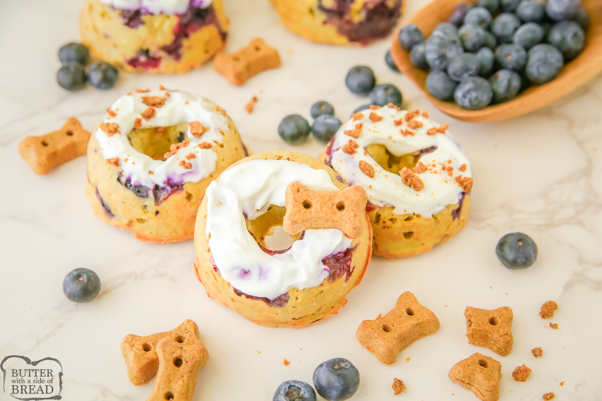 topping homemade blueberry dog treats with yogurt