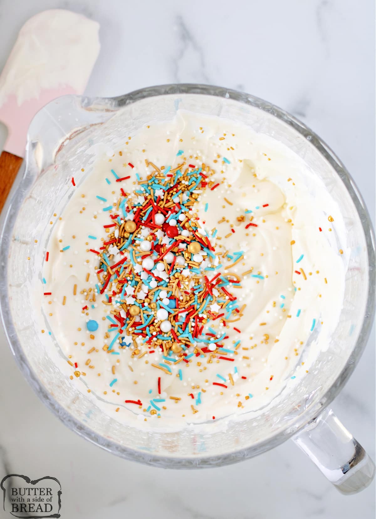 Mixing sprinkles into homemade ice cream. 