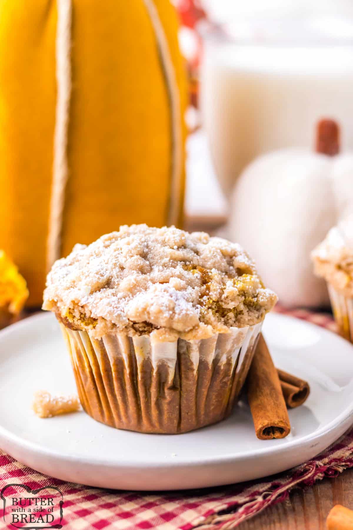 Copycat Costco Pumpkin Muffins are moist, flavorful, and topped with a crumb topping and powdered sugar. These are easy to make at home and are the best sweet treat for fall!