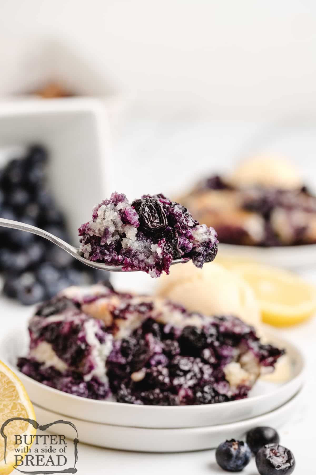 Spoonful of blueberry cobbler dessert.