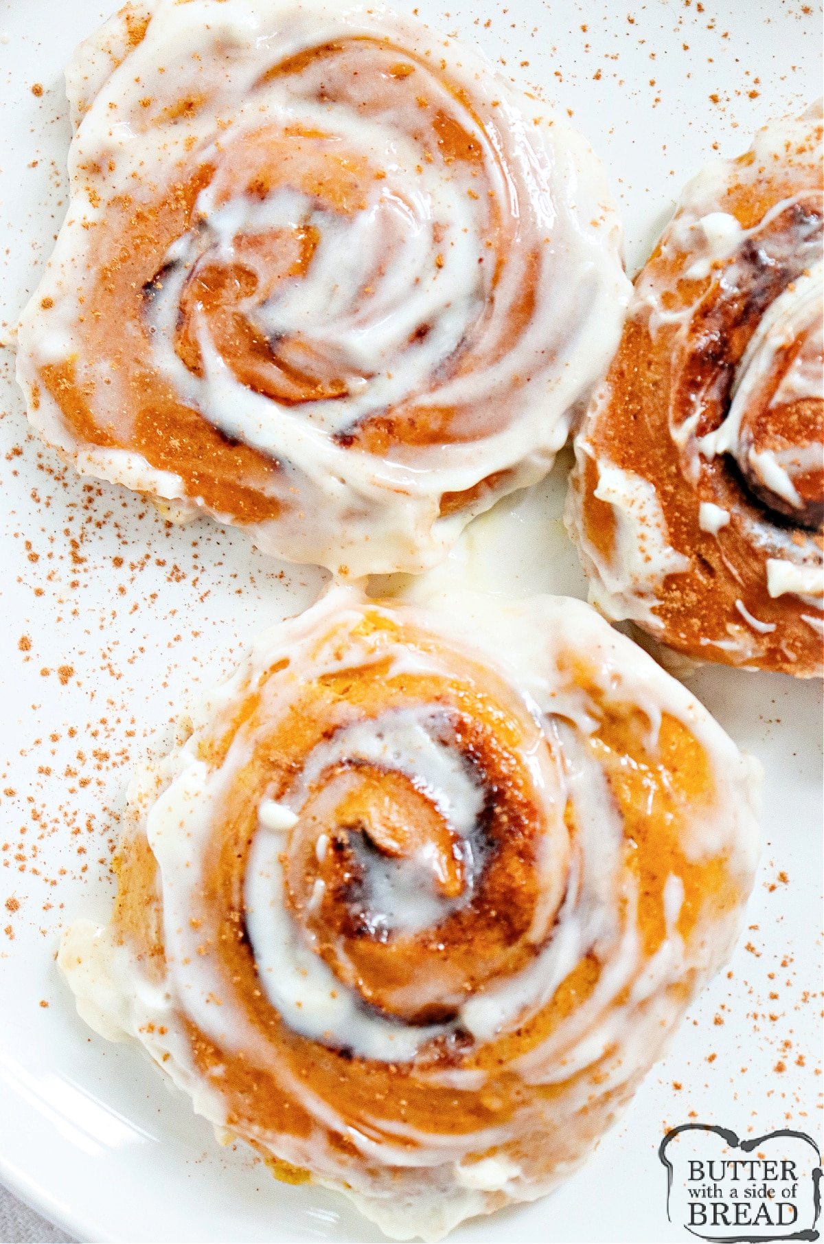 Pumpkin Cinnamon Rolls are light, soft, and packed with pumpkin flavor. These delicious cinnamon rolls are made completely from scratch with a simple cream cheese frosting.