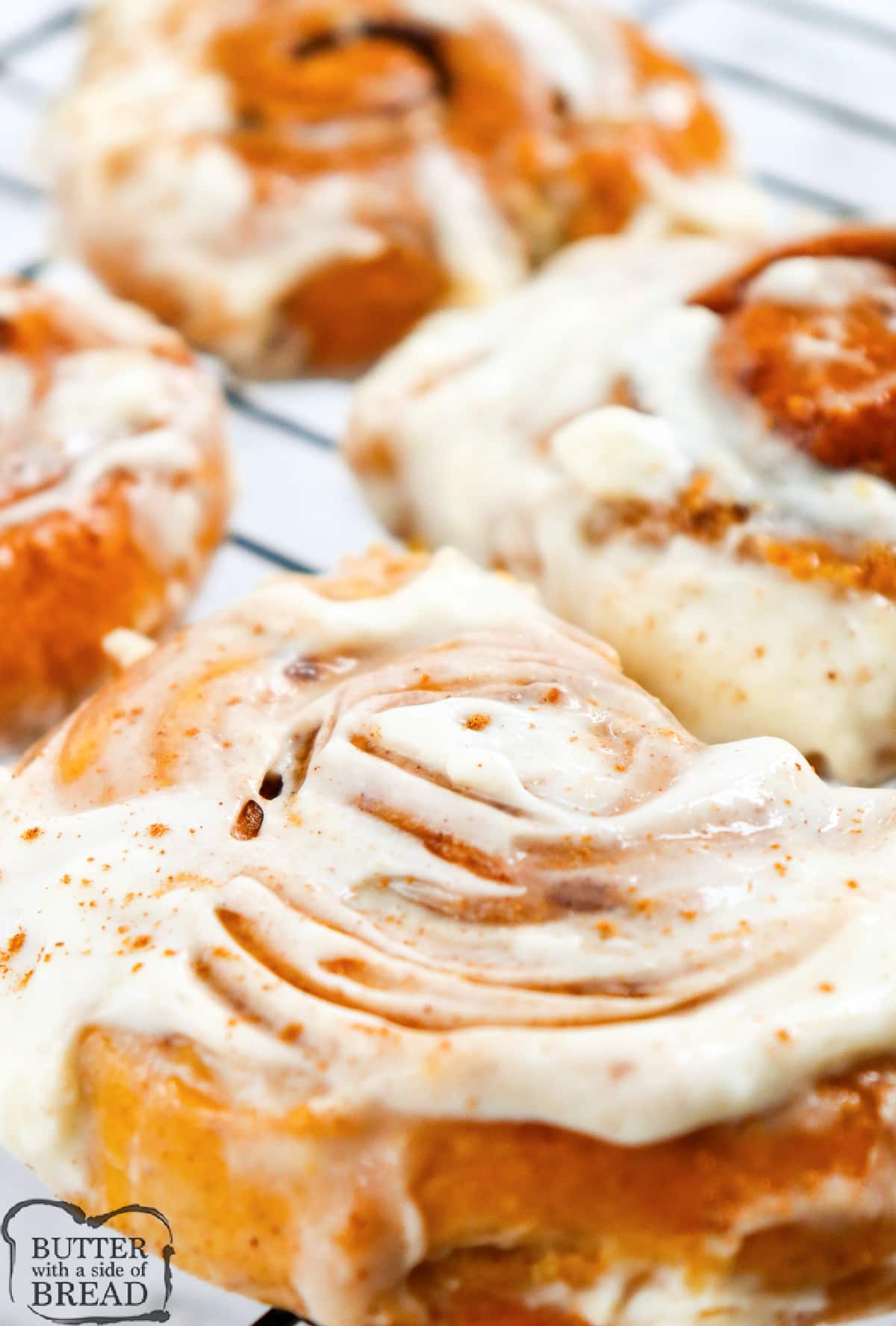 Pumpkin Cinnamon Rolls are light, soft, and packed with pumpkin flavor. These delicious cinnamon rolls are made completely from scratch with a simple cream cheese frosting.