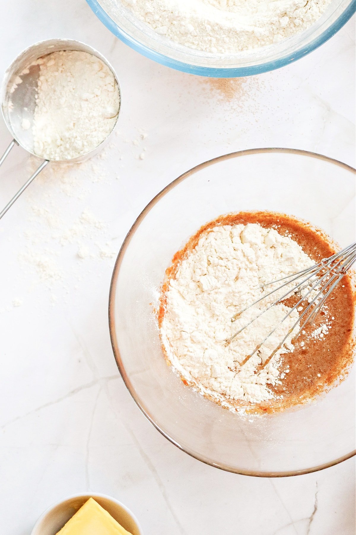 Add flour to cinnamon roll dough.