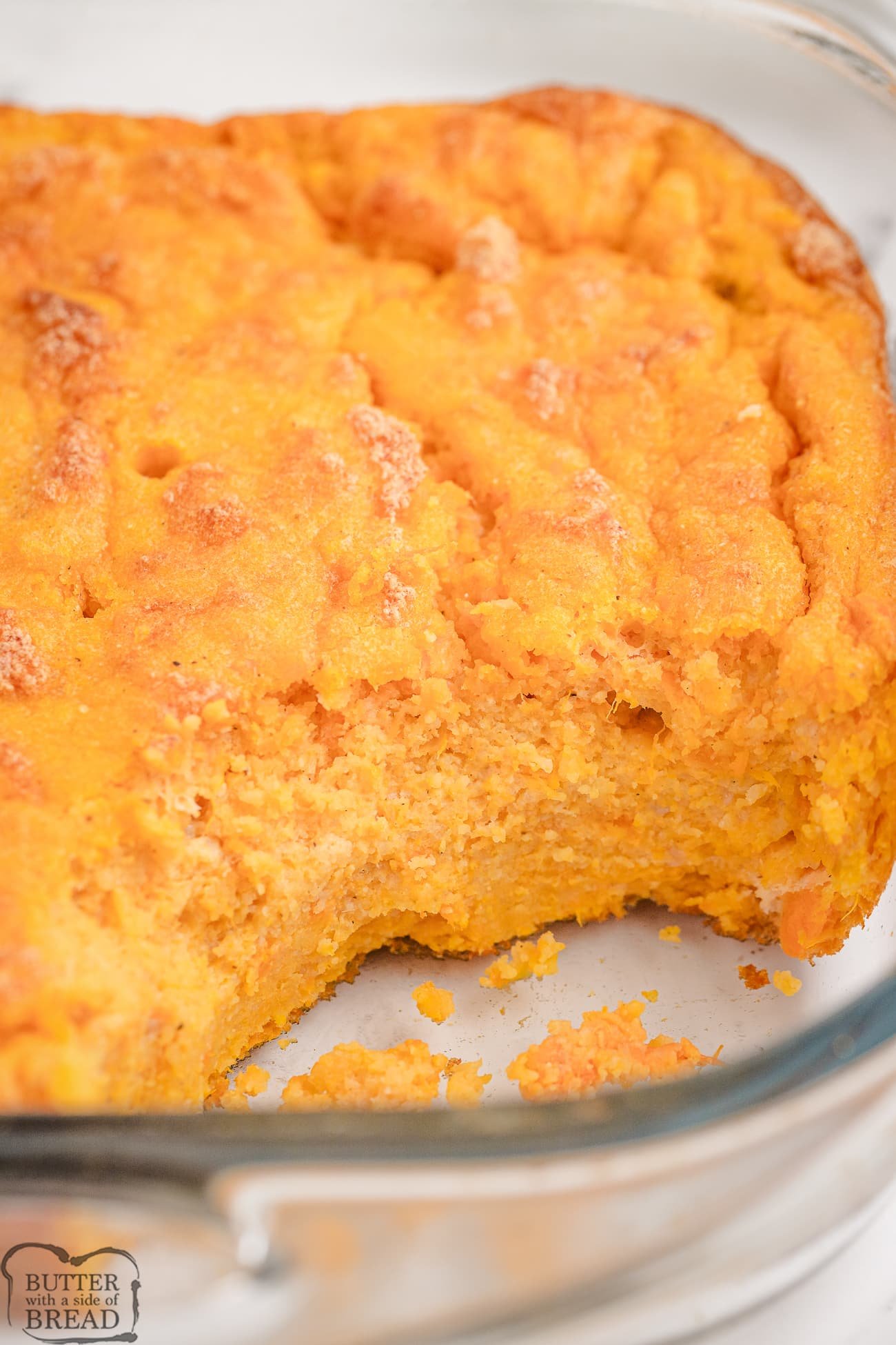 classic southern sweet potato spoon bread with a scoop taken out