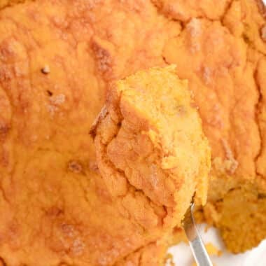 taking a scoop out of sweet potato spoon bread