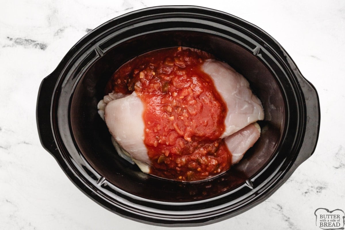 Salsa and chicken in slow cooker.