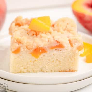 peach crumb cake on a white plate