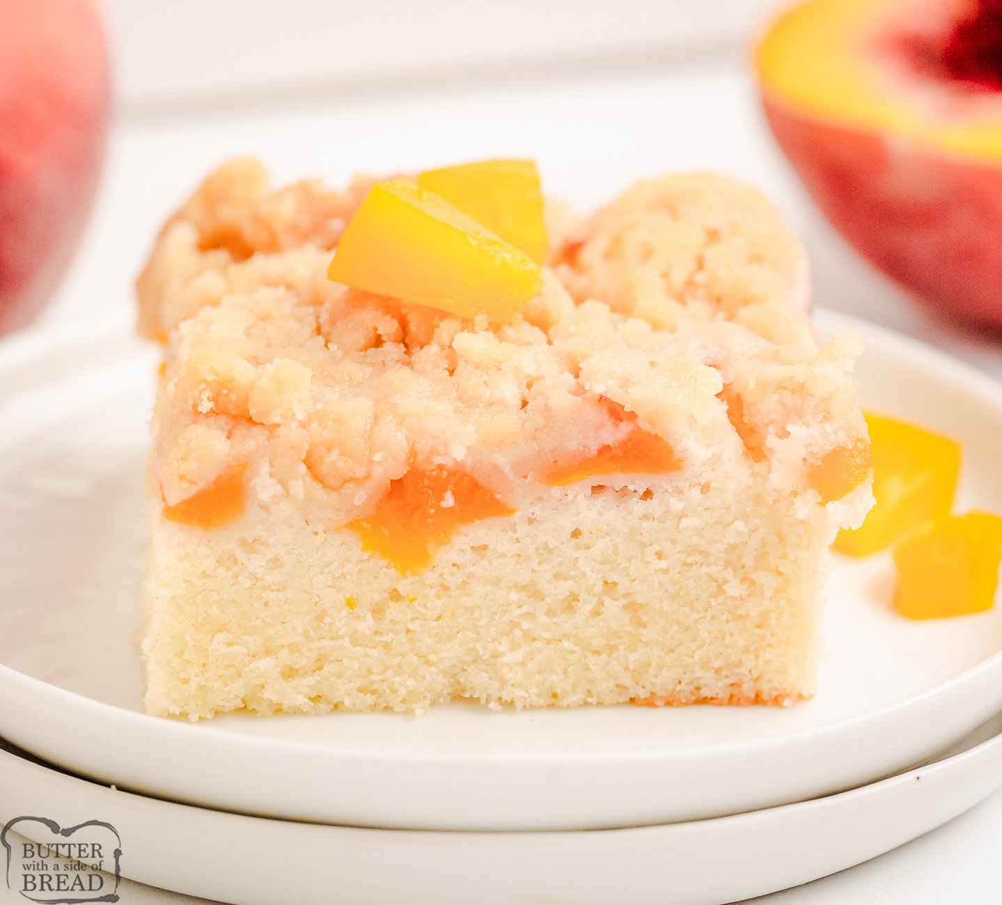 peach crumb cake on a white plate