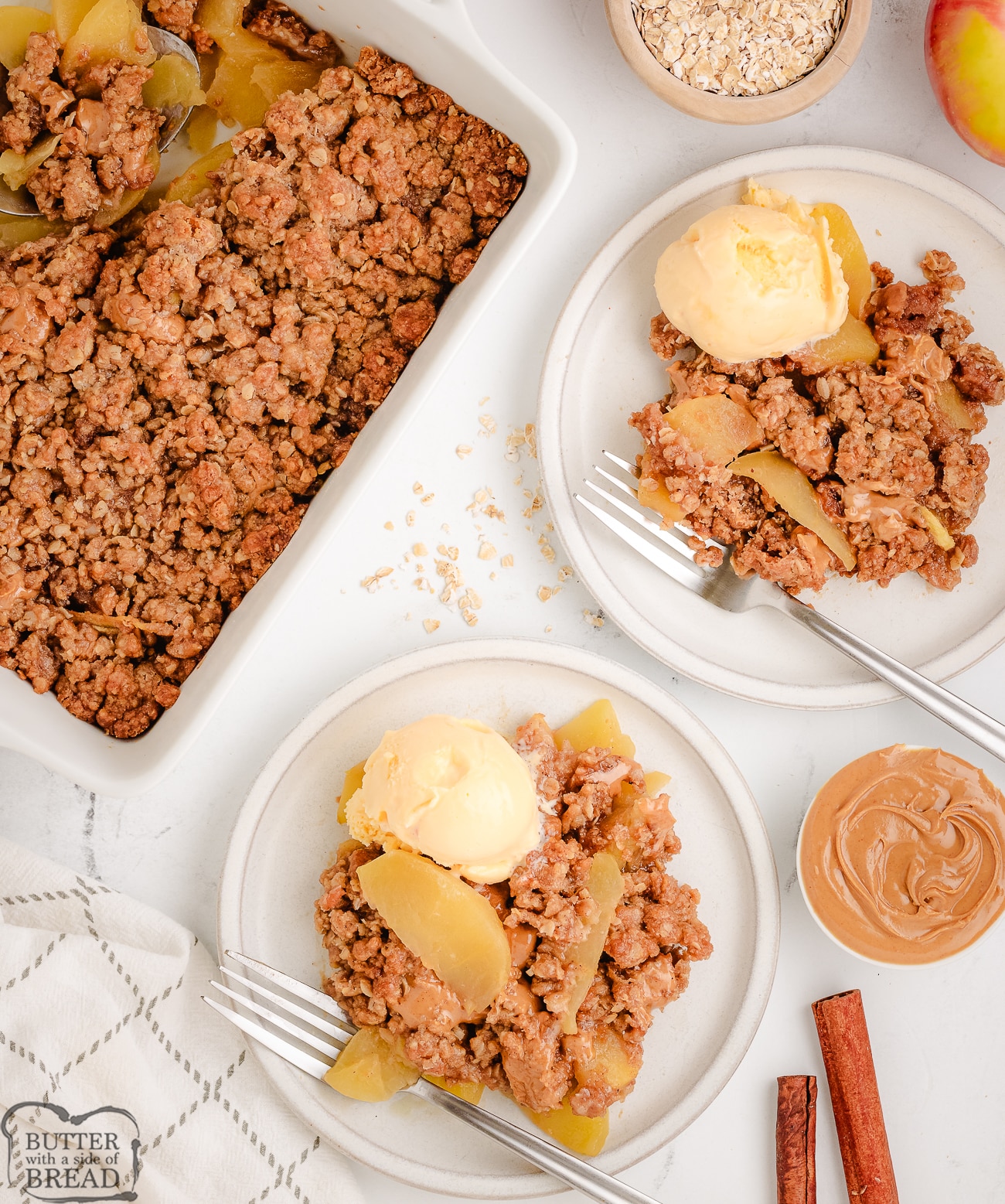peanut butter apple crisp in a white baking dish