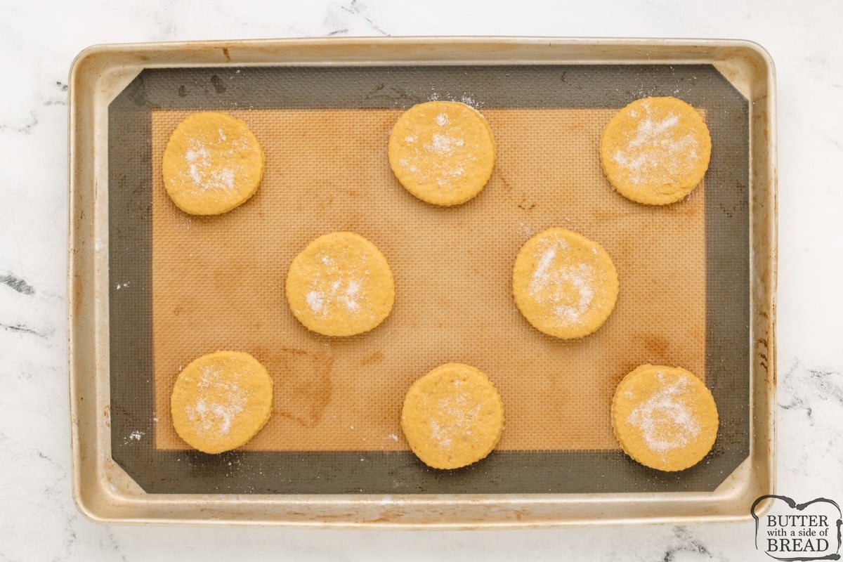 Sprinkle sugar on top the uncooked biscuits. 