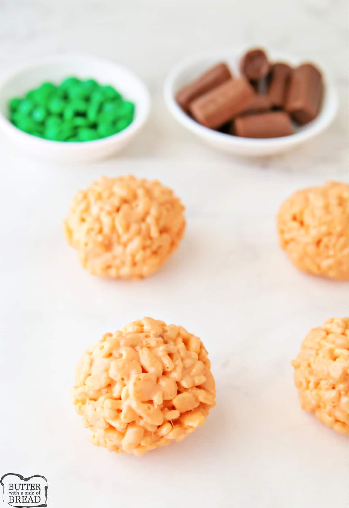 Balls formed with rice krispie treat mixture. 