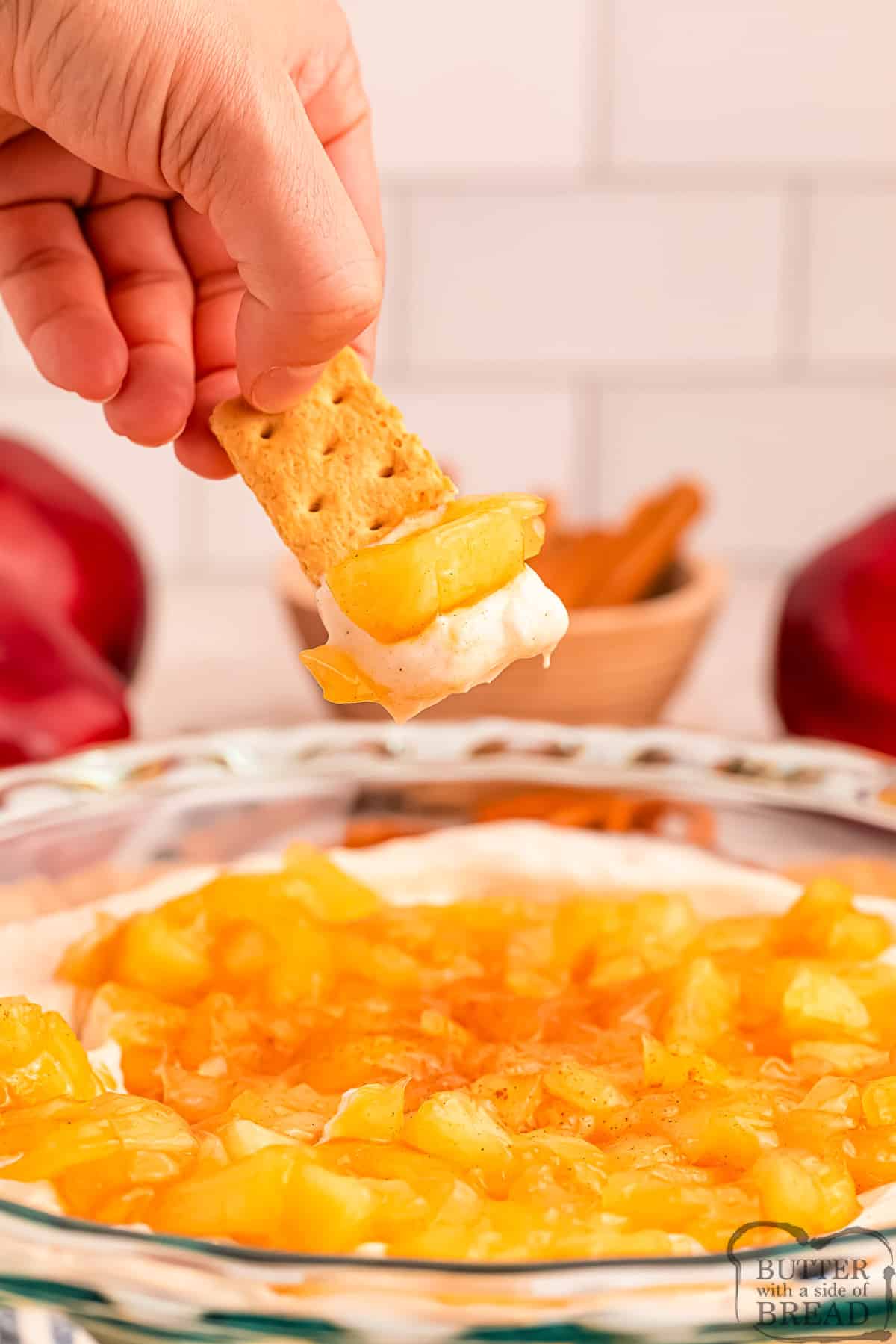 Graham cracker dipped in apple pie dip.