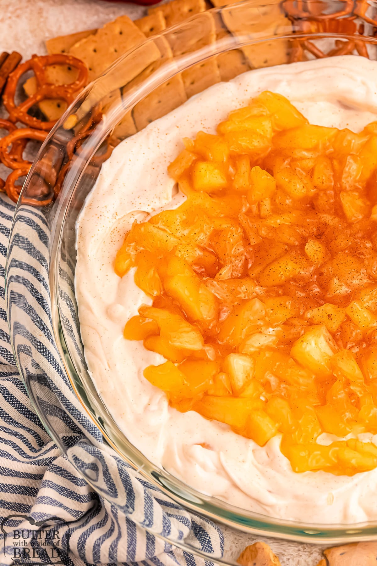 Apple Pie Dip is deliciously creamy and perfect for dipping pretzels, graham crackers, and fruit slices. It requires only six simple ingredients and tastes just like apple pie!