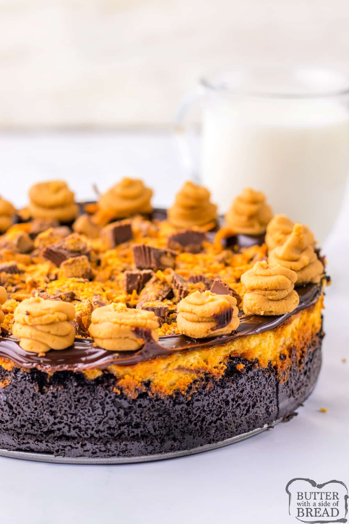 Cheesecake with peanut butter frosting, Reese's Peanut Butter cups, and Butterfingers. 