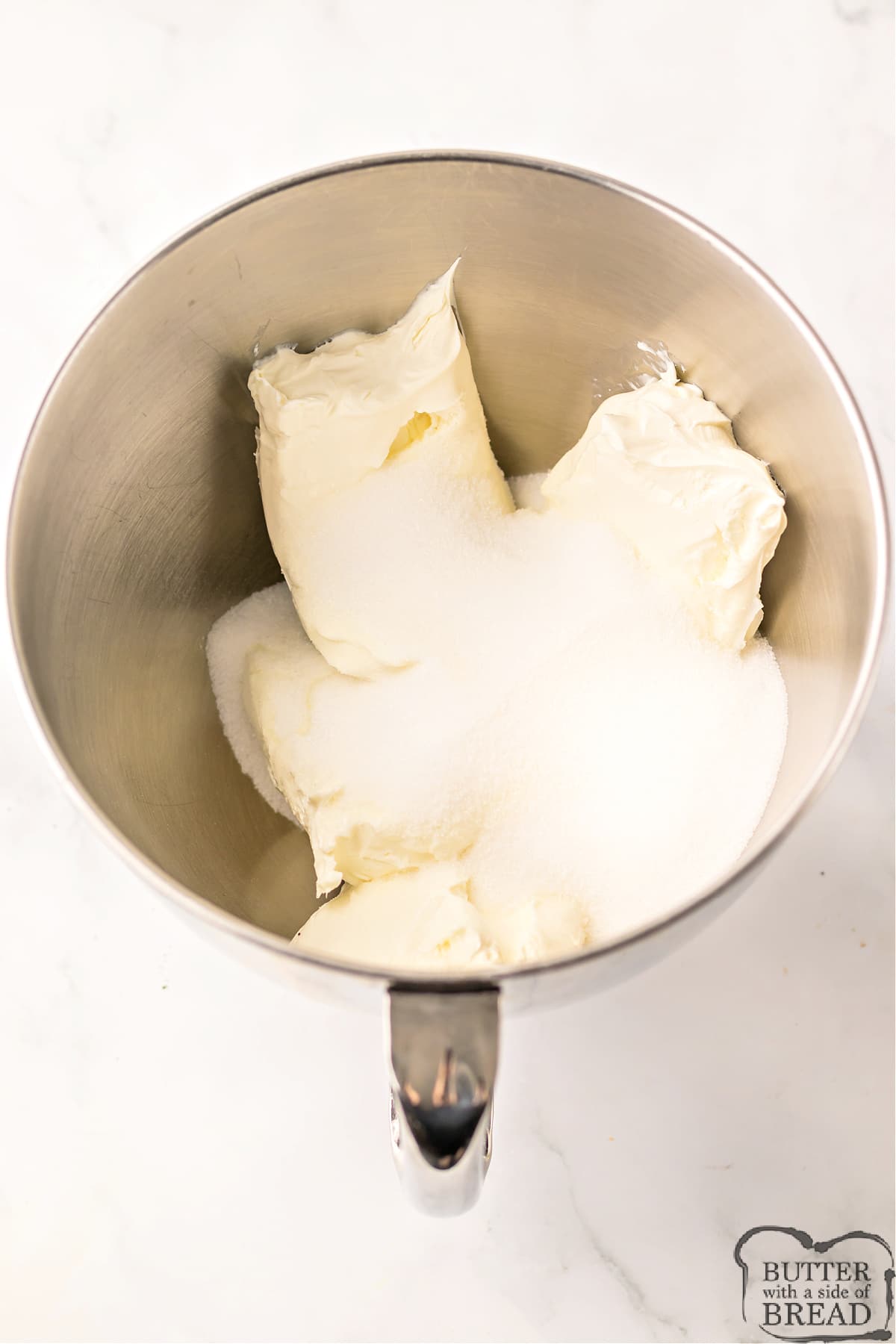 Mixing cream cheese with sugar. 