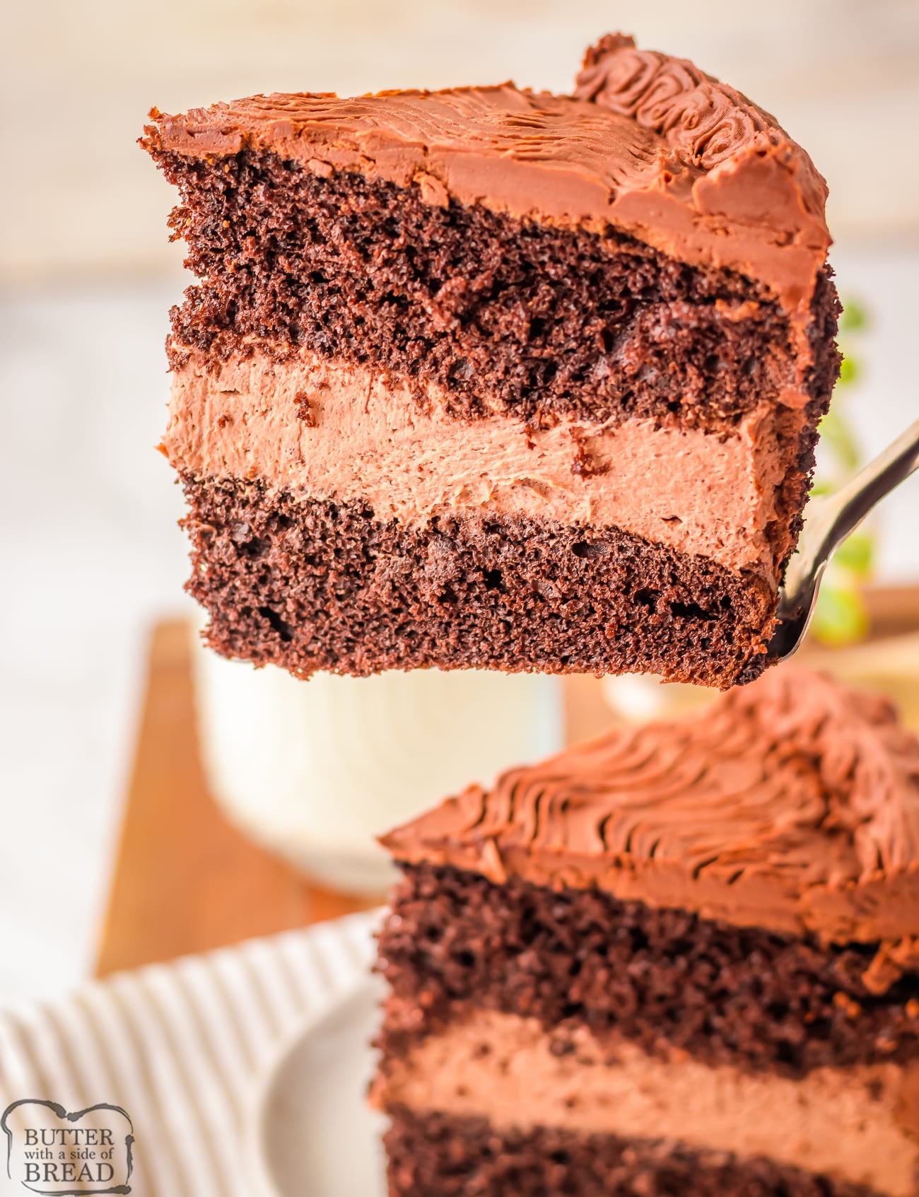 serving up a slice of chocolate mousse cake