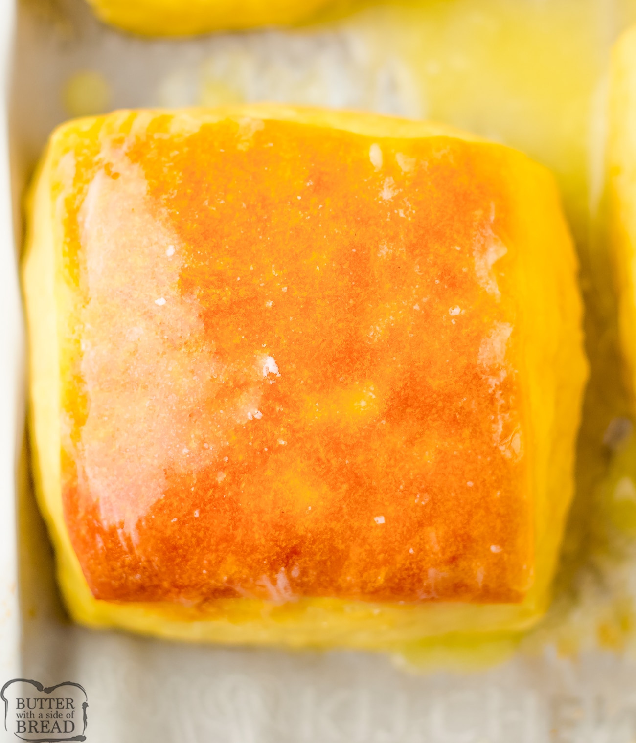 square yeast roll brushed with butter