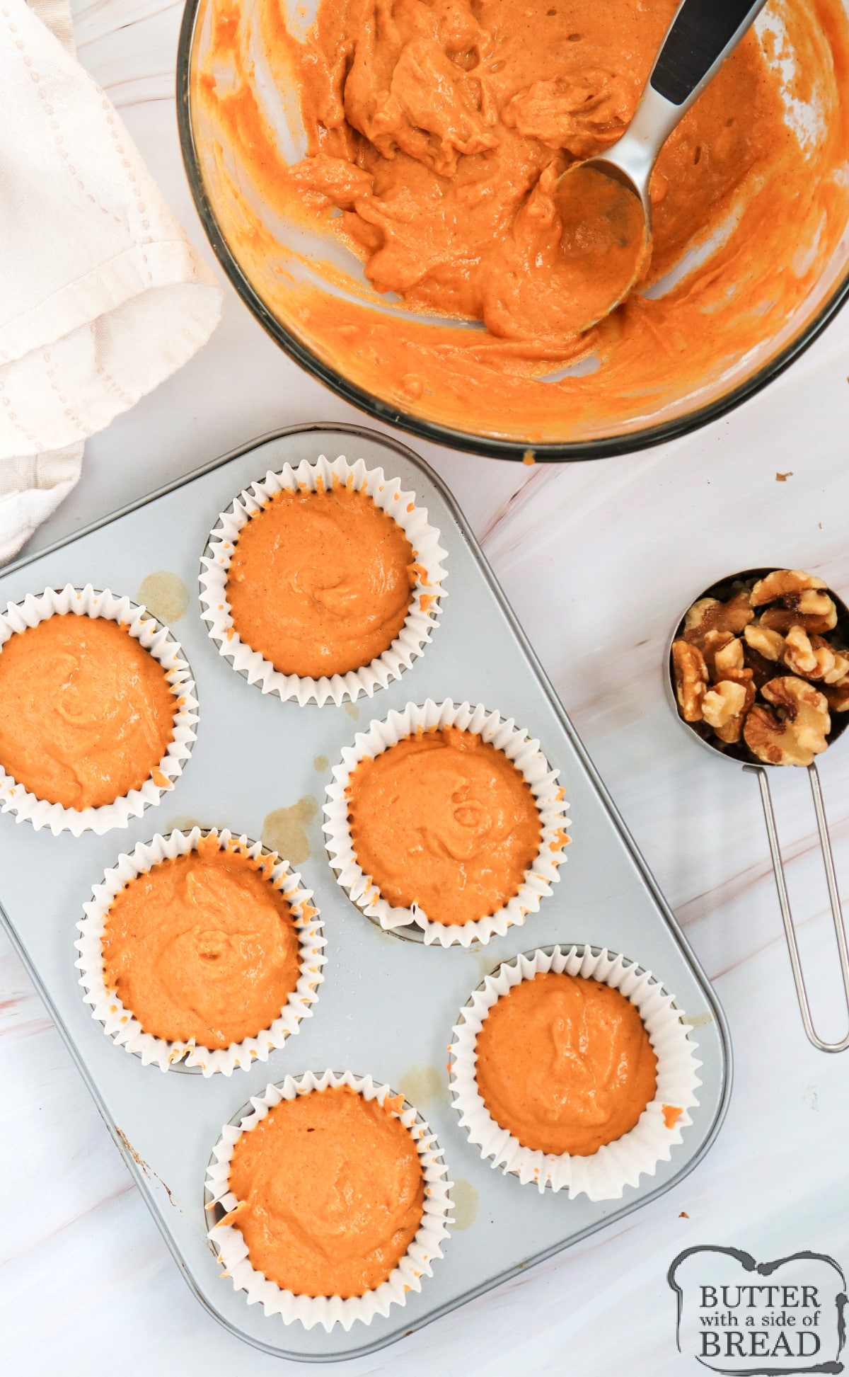 Scoop muffin batter into muffin tin.