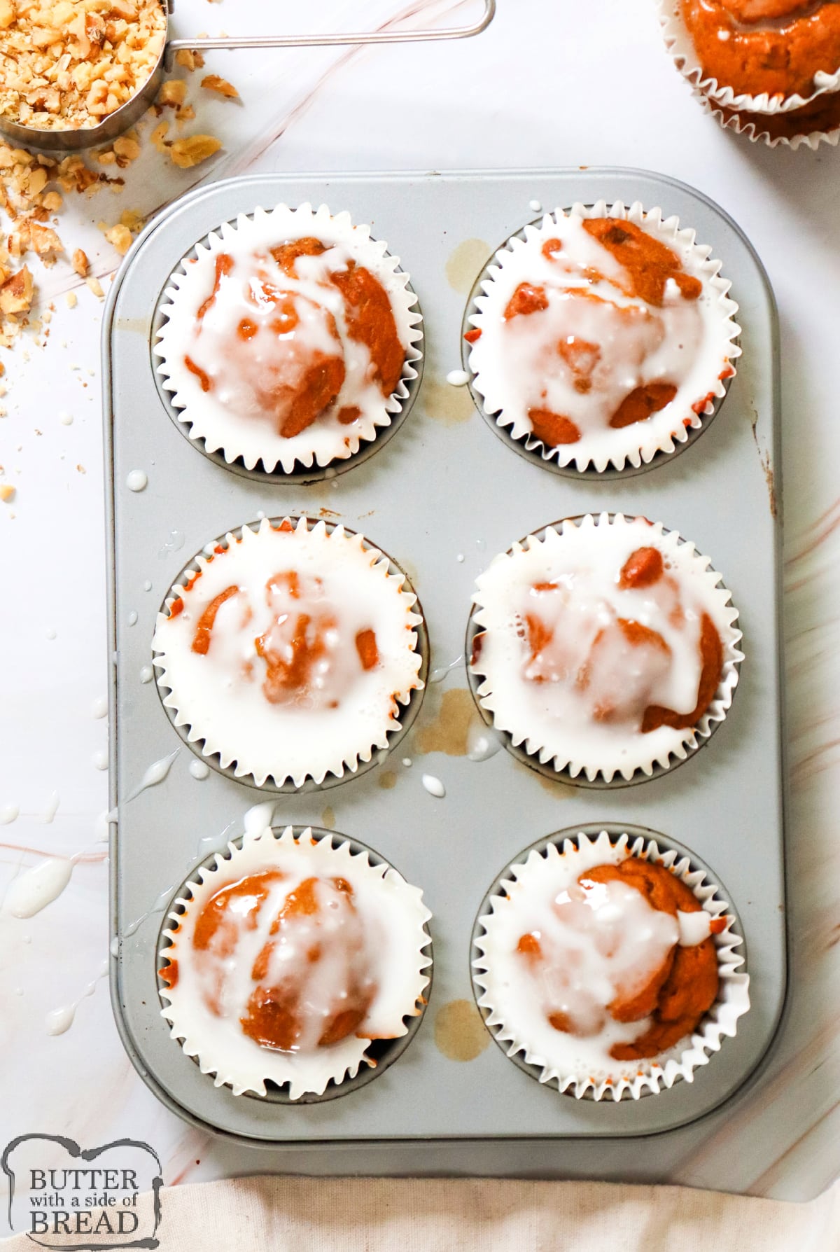 Add icing to the baked muffins.