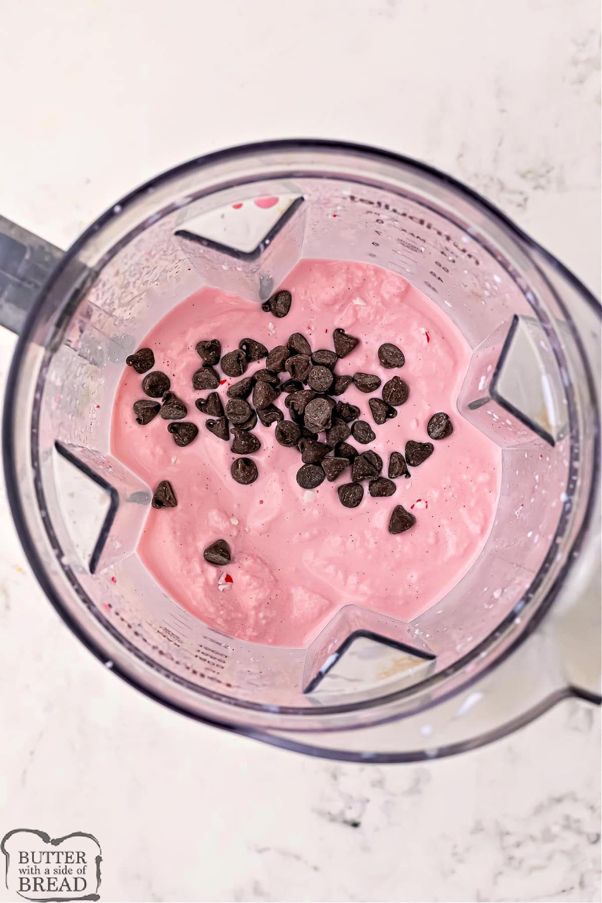 Add chocolate chips to peppermint milkshake. 