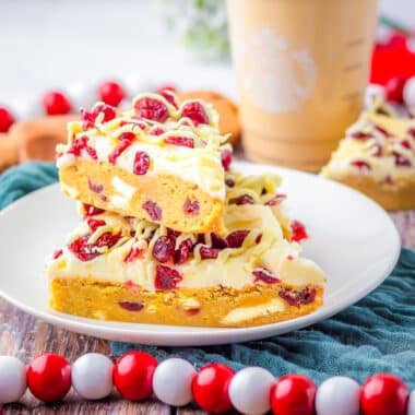 copycat Starbuck's Cranberry Bliss bars on a white plate with Christmas decor