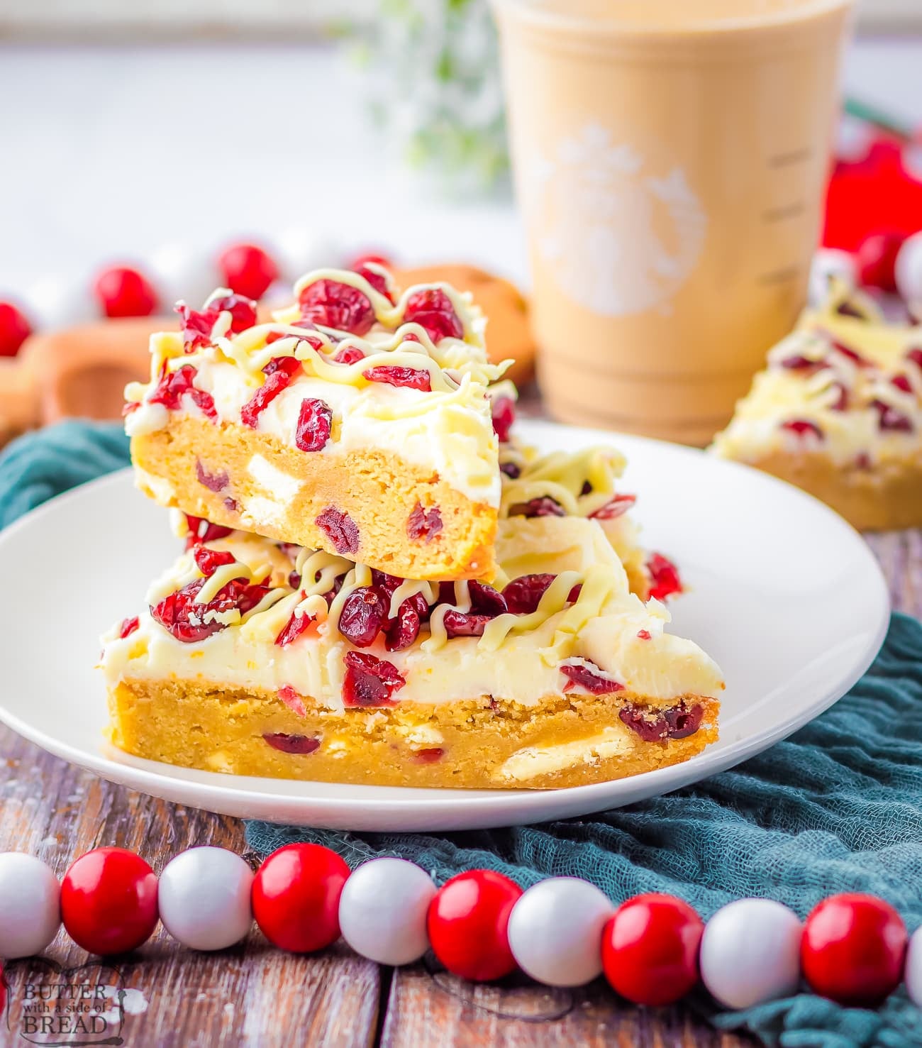 copycat Starbuck's Cranberry Bliss bars on a white plate with Christmas decor