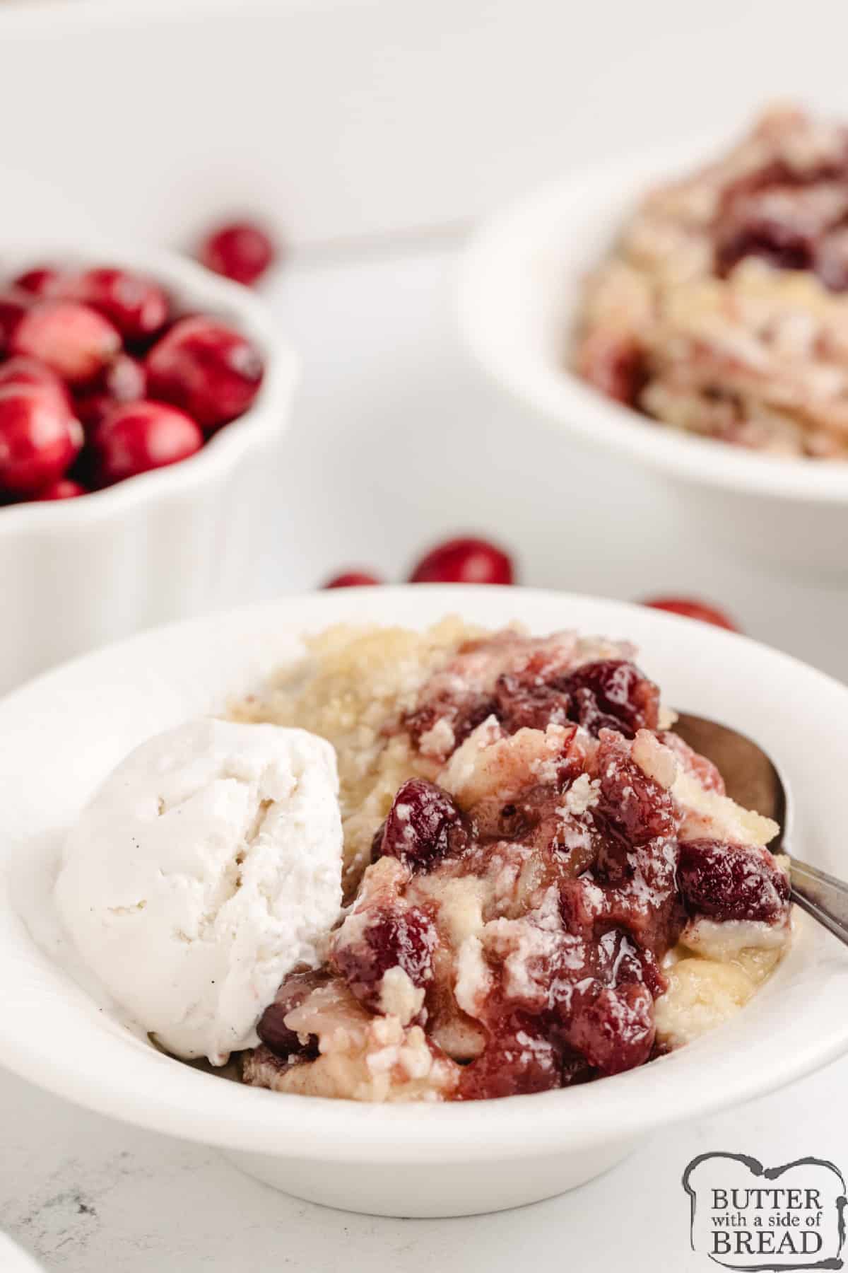 Cranberry Apple Cobbler is made with cranberry sauce, sliced apples, and a sugar cookie crust. This simple 6-ingredient cobbler recipe is the perfect fall dessert!