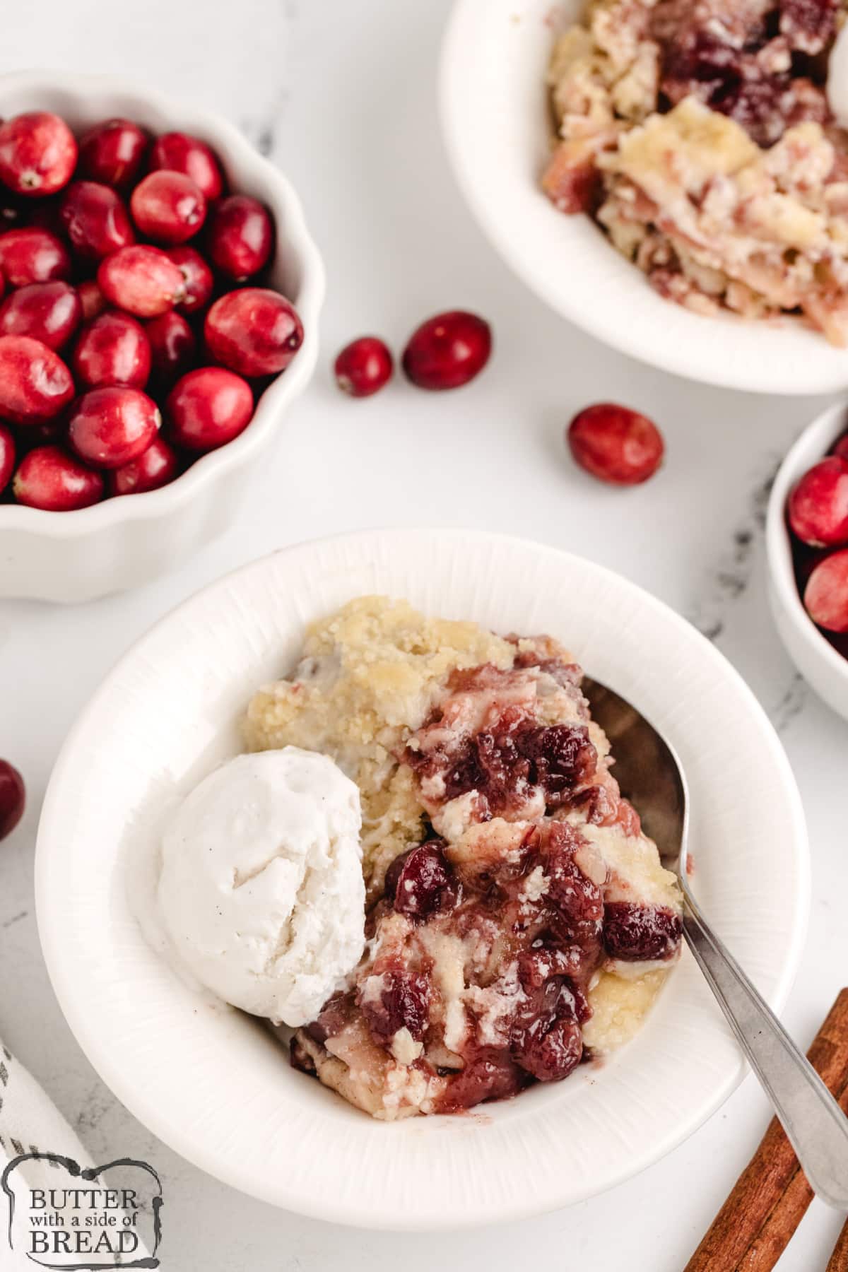 Cranberry Apple Cobbler is made with cranberry sauce, sliced apples, and a sugar cookie crust. This simple 6-ingredient cobbler recipe is the perfect fall dessert!