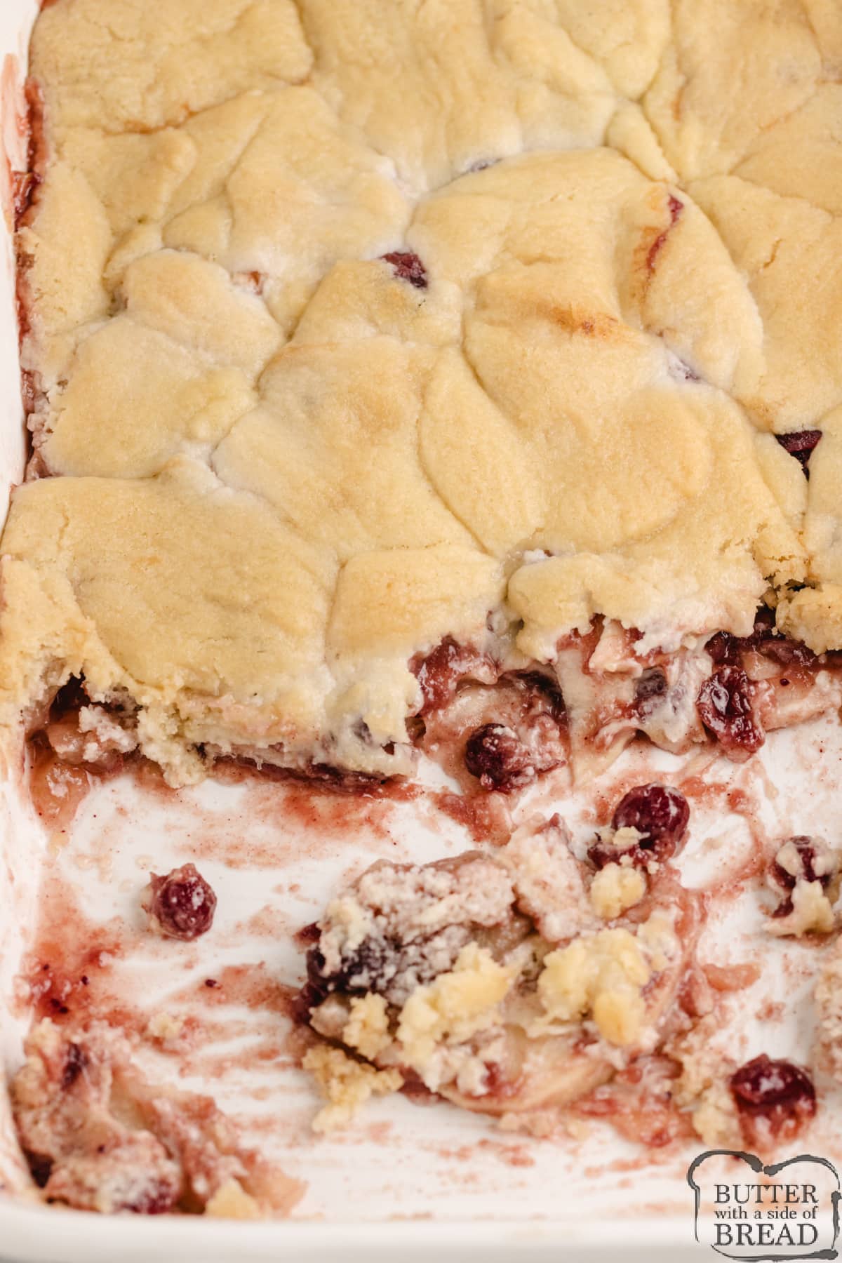Cranberry Apple Cobbler is made with cranberry sauce, sliced apples, and a sugar cookie crust. This simple 6-ingredient cobbler recipe is the perfect fall dessert!