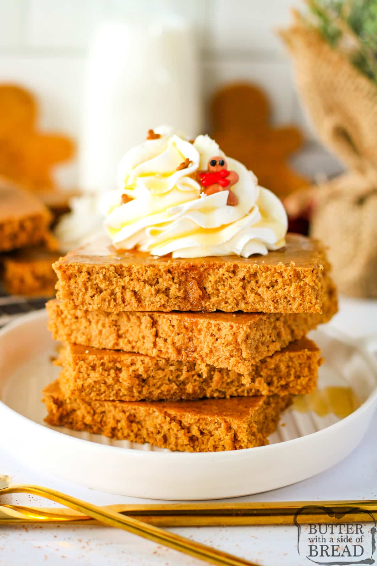 Gingerbread pancakes with whipped cream and maple syrup.