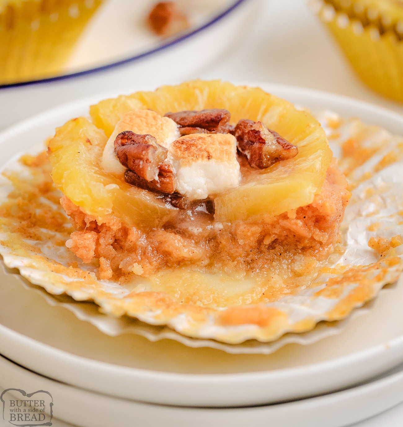 pineapple sweet potato cups topped with brown sugar pecans