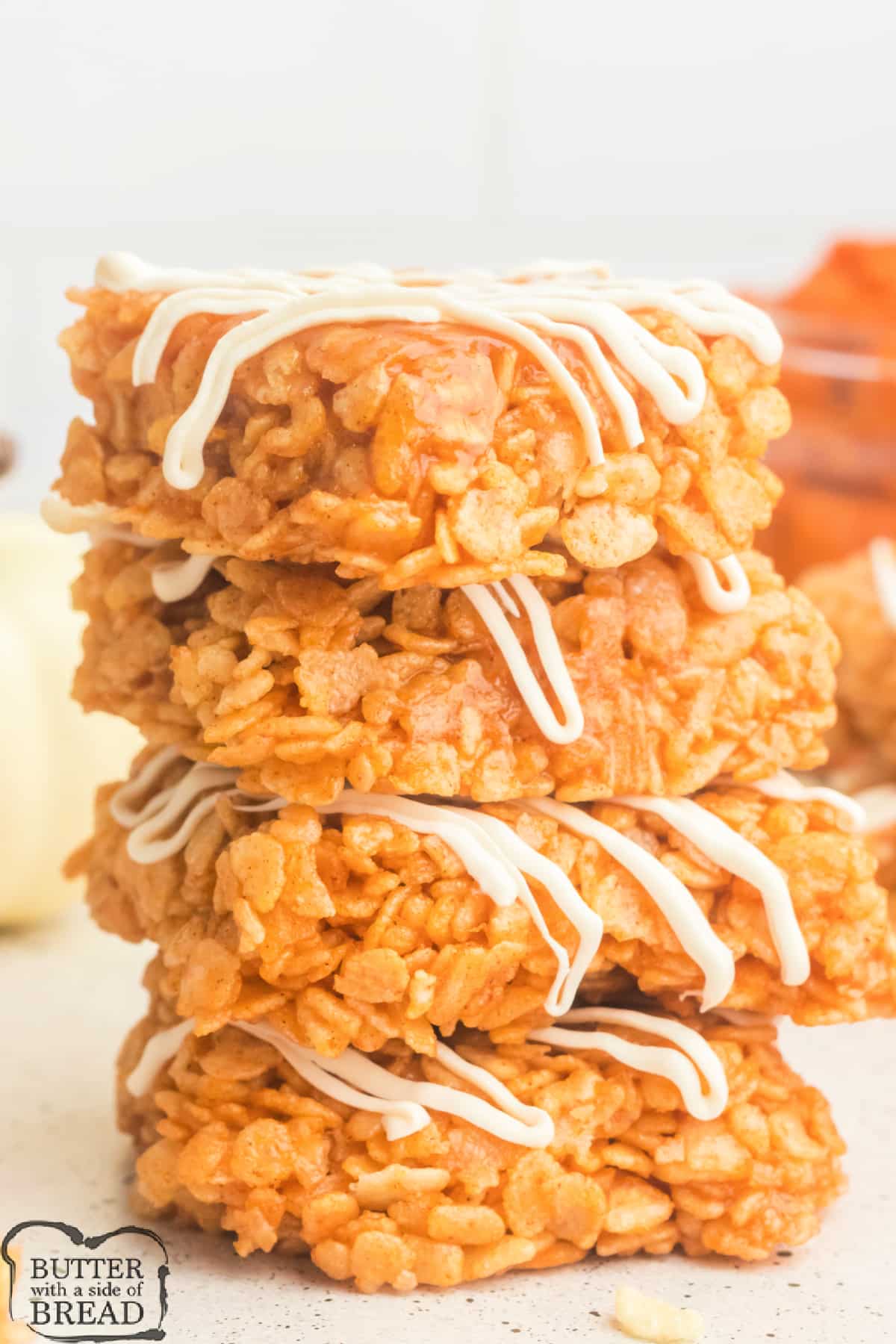 Stack of rice krispie treats made with pumpkin.
