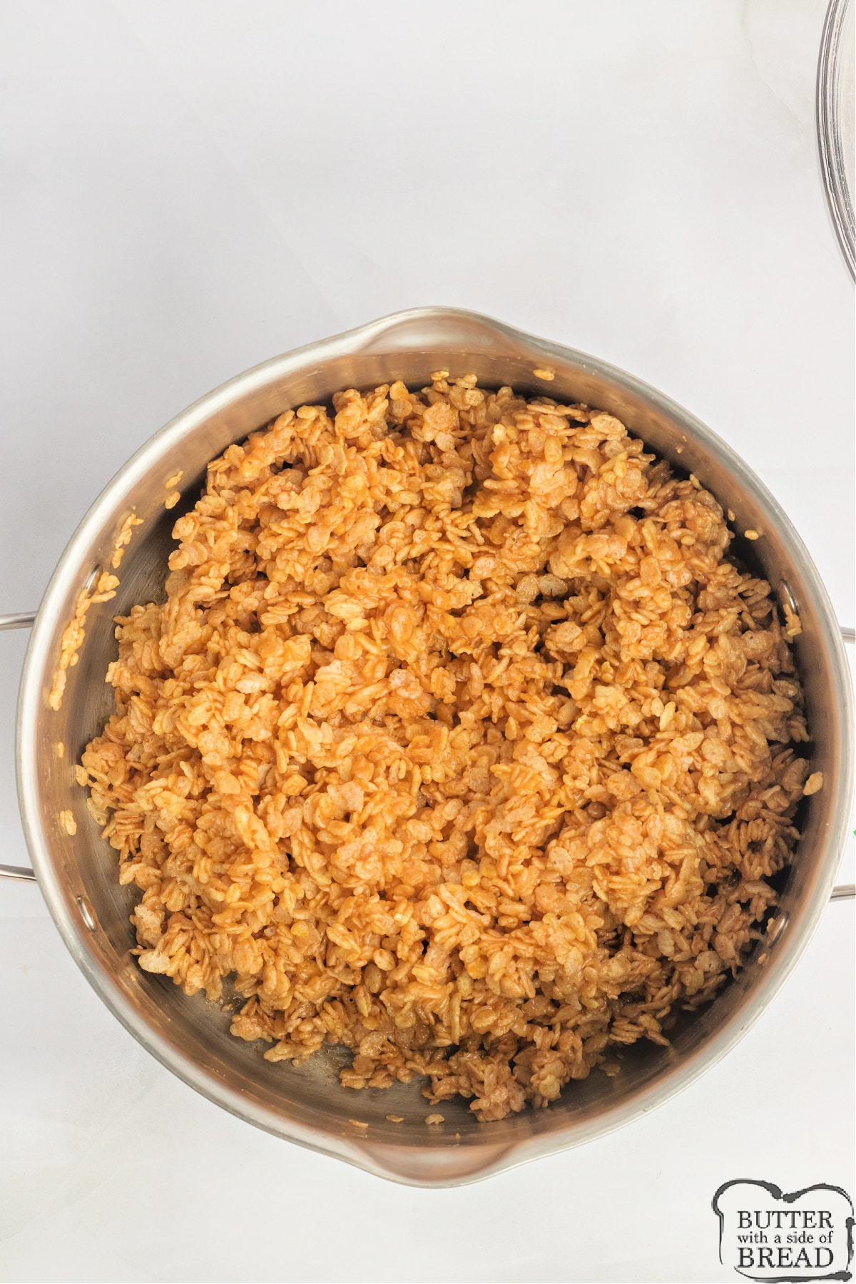 Add rice krispie cereal to pumpkin and marshmallow mixture.