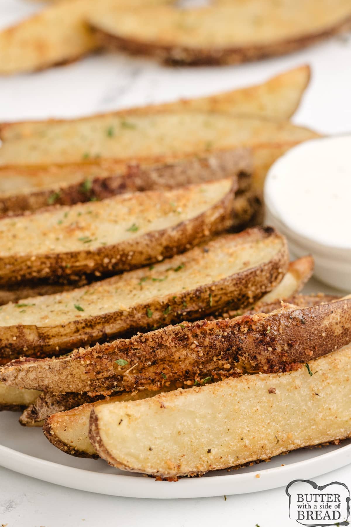 Roasted potato wedges made with spices and parmesan cheese.