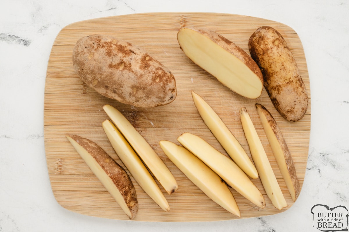 Slicing potatoes into wedges.