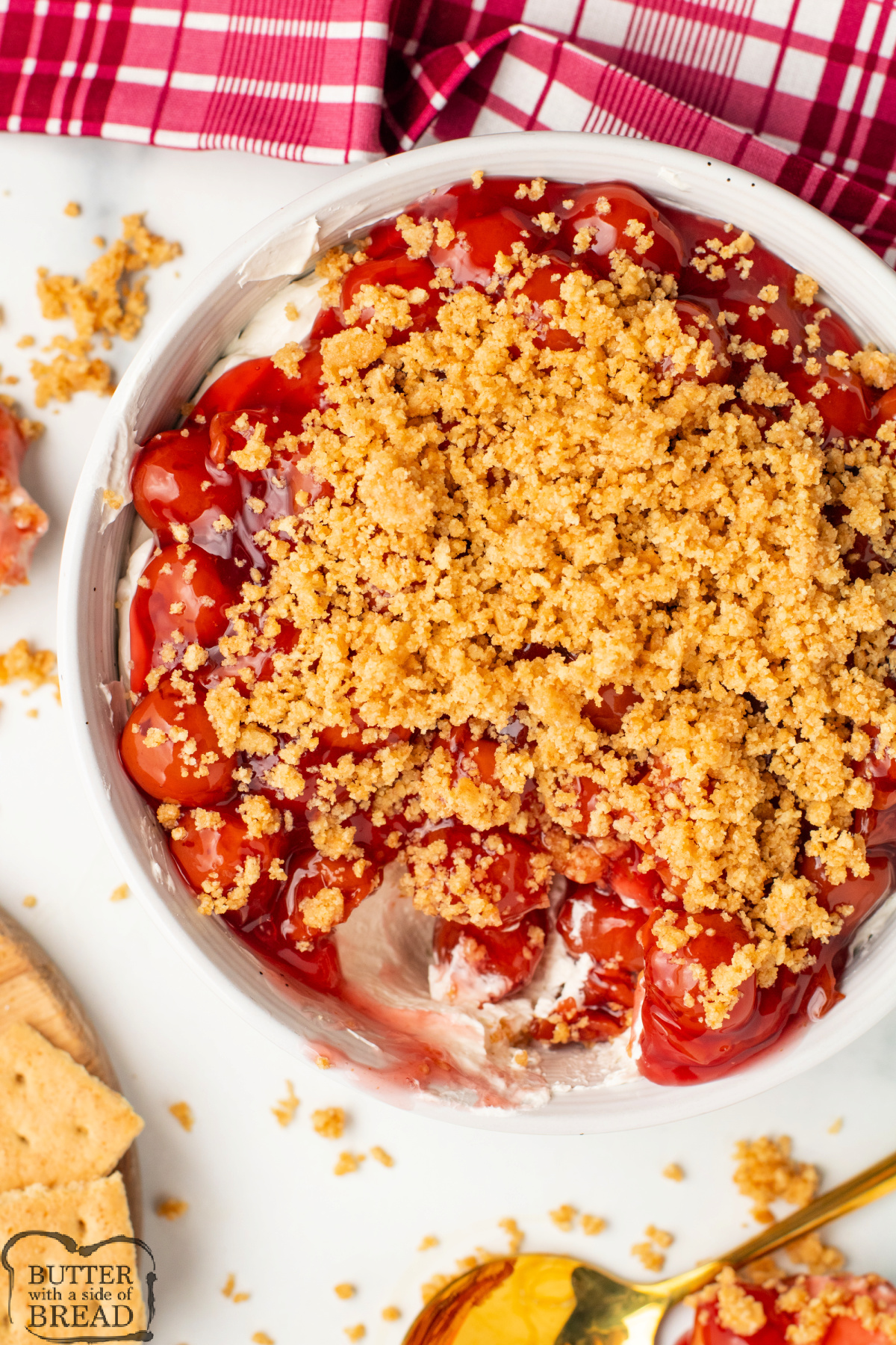 Cherry pie filling with cheesecake filling and graham cracker crumbs.