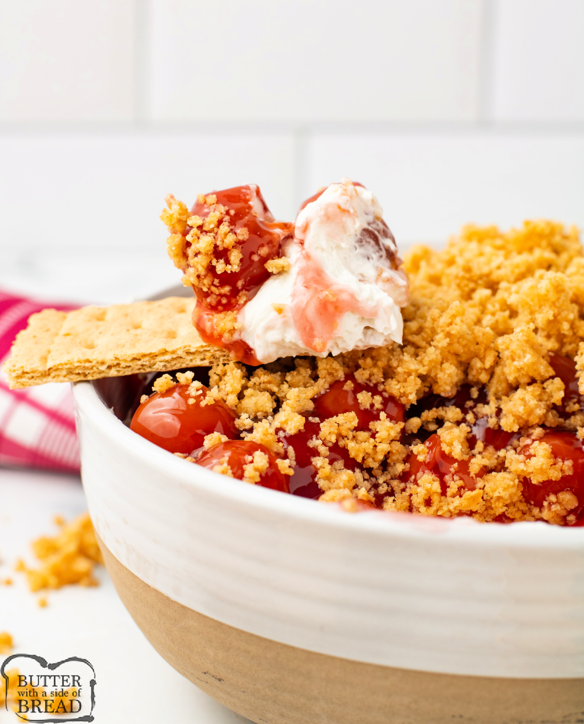 Cherry Cheesecake Dip is made with cream cheese, cherry pie filling, and graham cracker crumbs in less than 10 minutes! Delicious easy dessert dip recipe that tastes just like cheesecake!