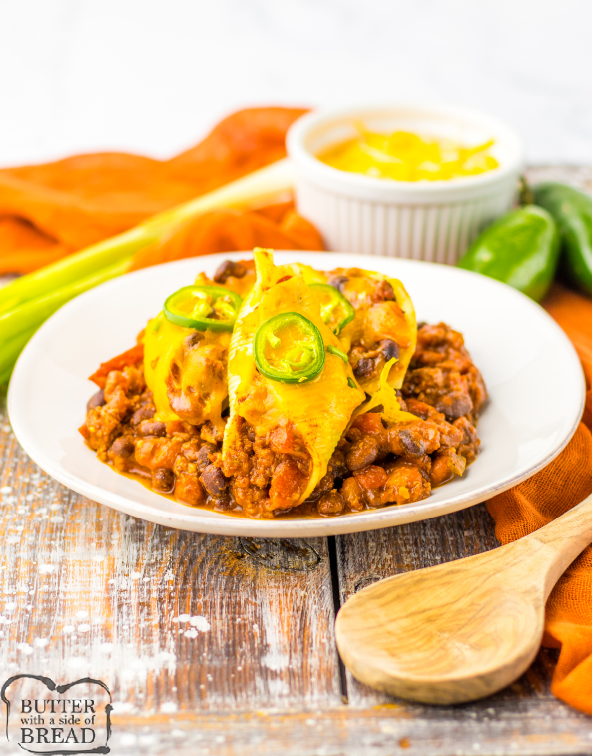 Chili Cheese Stuffed Shells are made with canned chili, ground beef, and lots of veggies. A quick, easy, weeknight meal that is ready in less than 30 minutes!