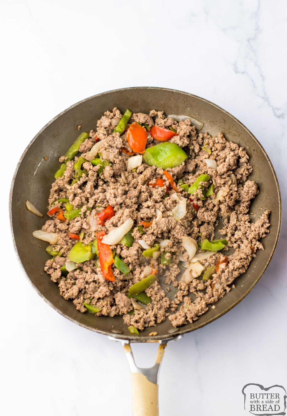 Cooked ground beef, pepper, and onions.